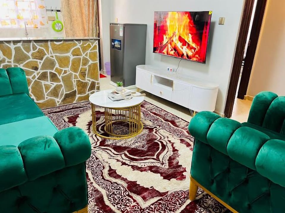 Classic Apartment, City View | Living area | 32-inch Smart TV with digital channels