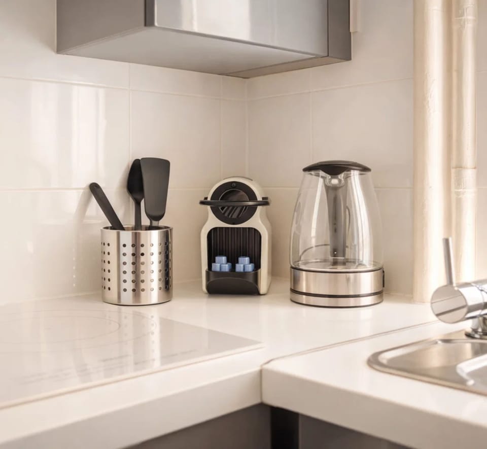 Deluxe Apartment, Courtyard View | Private kitchen | Espresso maker, electric kettle, toaster, freezer