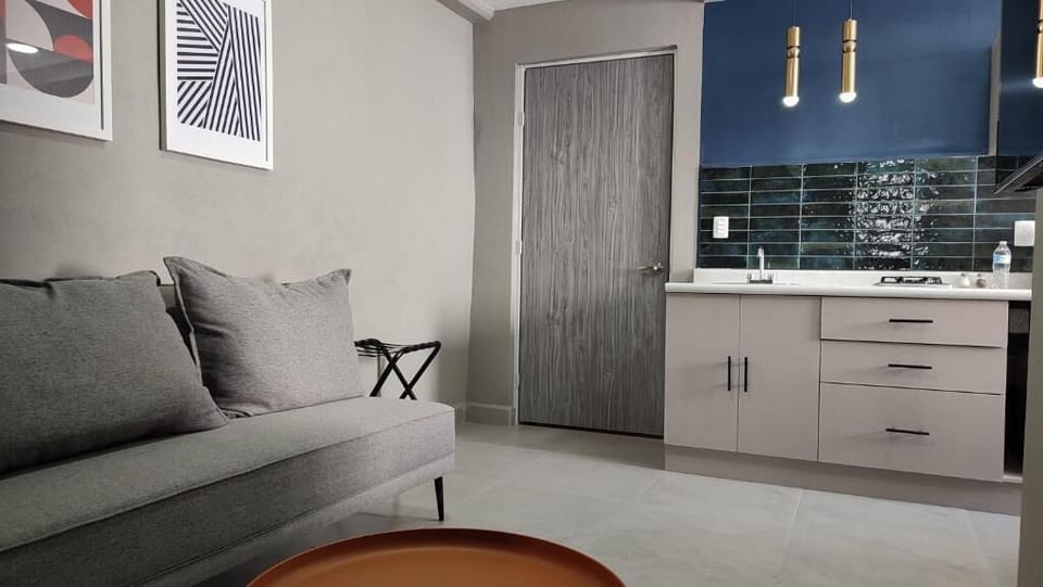 Family Apartment, 2 Bedrooms | Living area | 50-inch Smart TV with cable channels