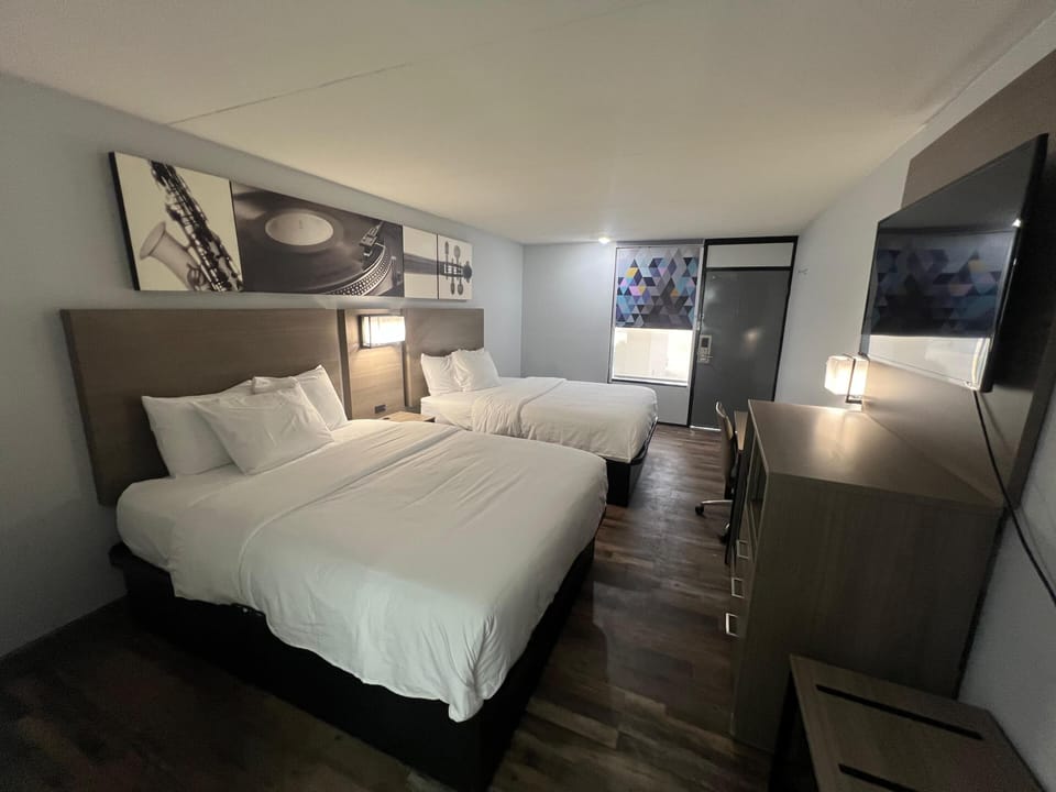 Premium bedding, desk, laptop workspace, free WiFi