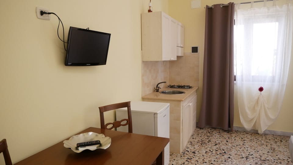Quadruple Room | Private kitchen | Fridge