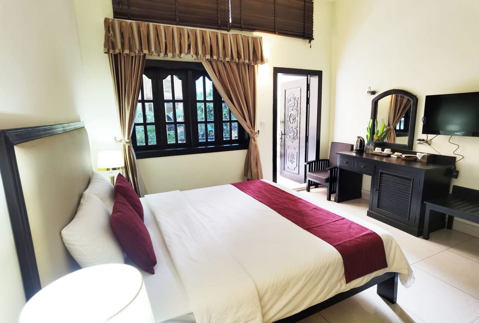 Deluxe Double Room, Balcony, City View | In-room safe, desk, laptop workspace, iron/ironing board