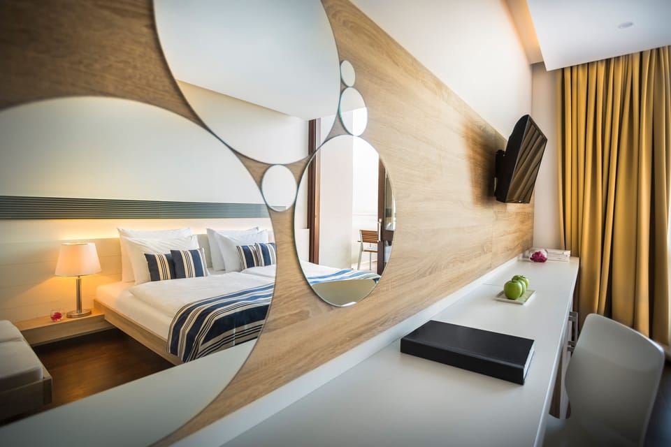 Premium Double Room, Sea View | Minibar, in-room safe, desk, iron/ironing board