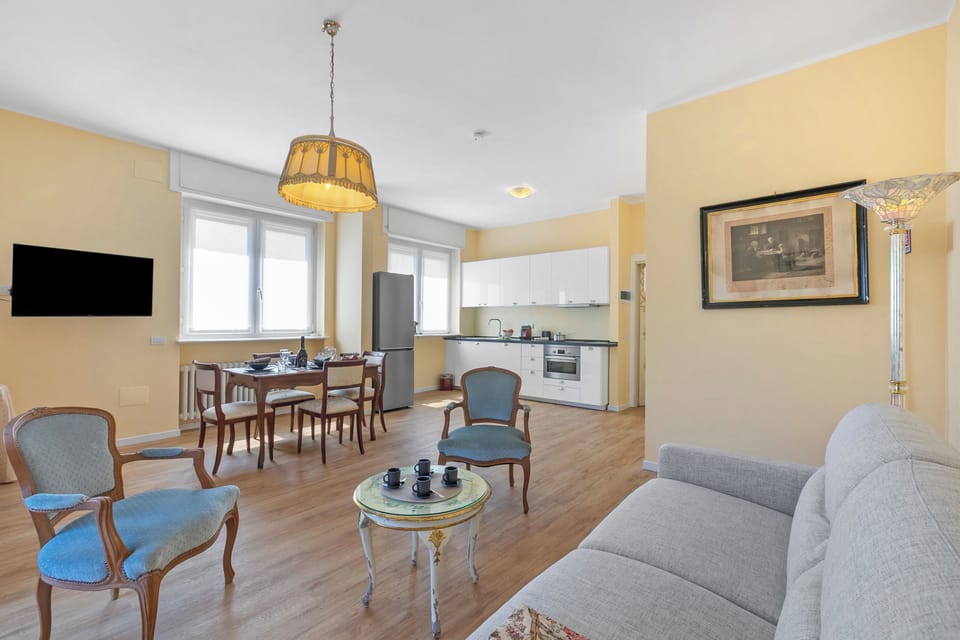Family Apartment, 1 Bedroom, Air conditioning (Strixia Apartment Stresa 50m From) | Living area | 21-inch flat-screen TV with cable channels