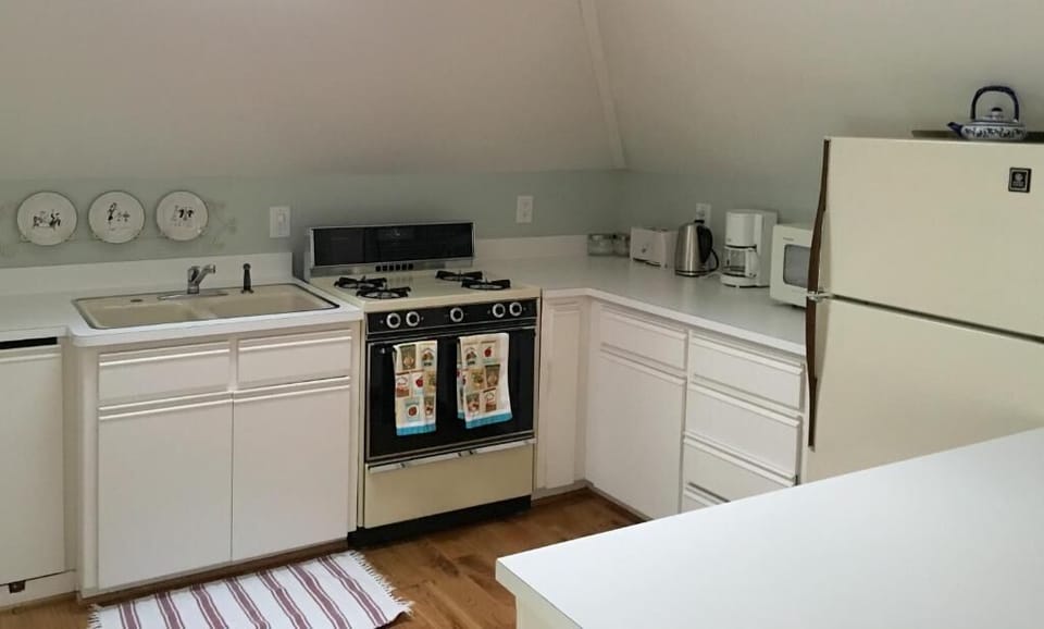 Full-size fridge, espresso maker, electric kettle, coffee grinder