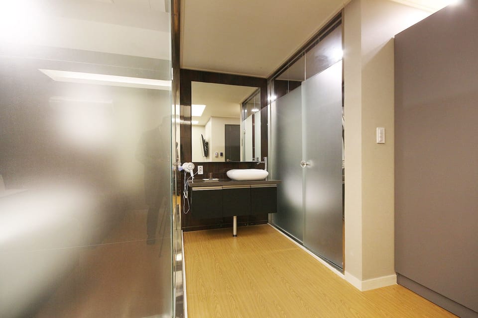 Superior Twin Room | Bathroom | Designer toiletries, hair dryer, bathrobes, slippers