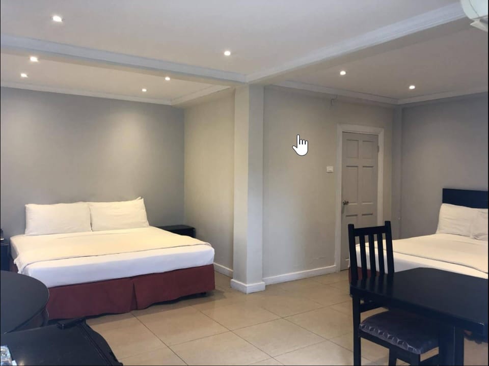 Family Room, 2 Queen Beds | Iron/ironing board, WiFi (free), bed sheets