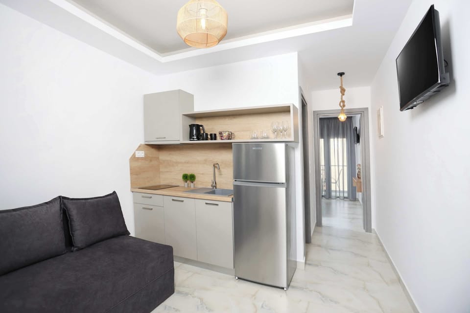 Deluxe Apartment, 1 Bedroom | Living area | 28-inch LED TV with satellite channels