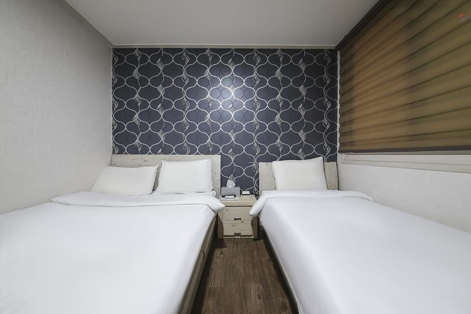 Basic Twin Room, City View | Living area | TV