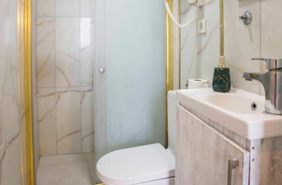 Room, Sea View | Bathroom | Shower, hair dryer, towels, soap