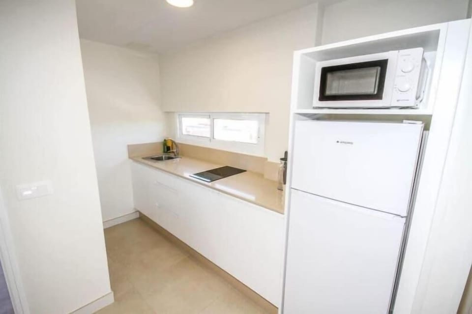 Fridge, microwave, electric kettle, toaster