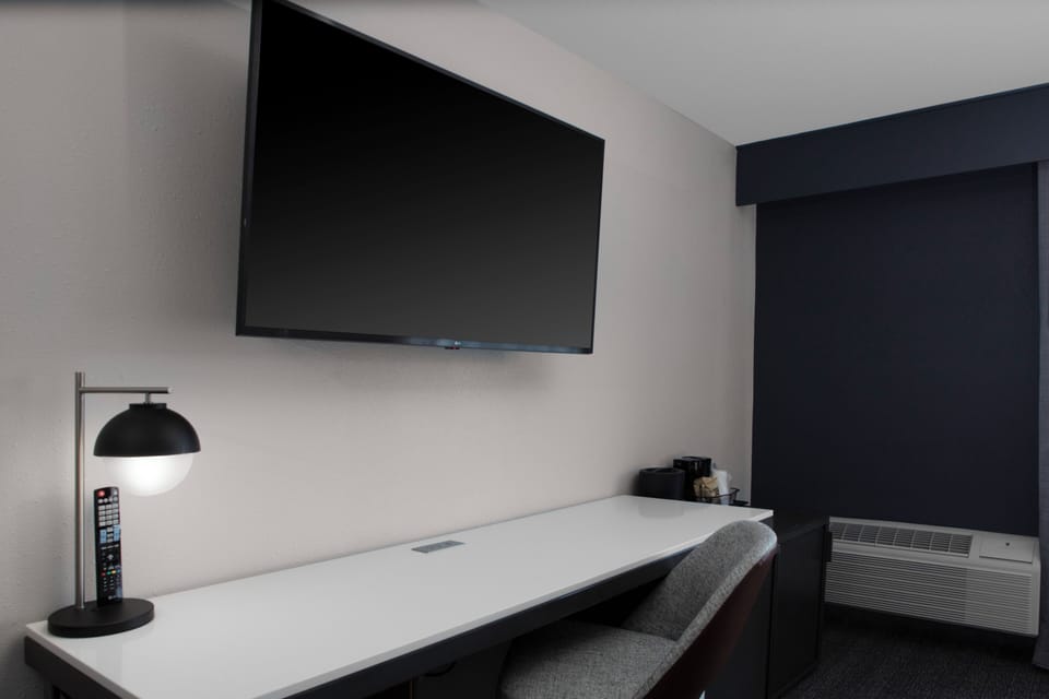 Laptop workspace, blackout drapes, iron/ironing board