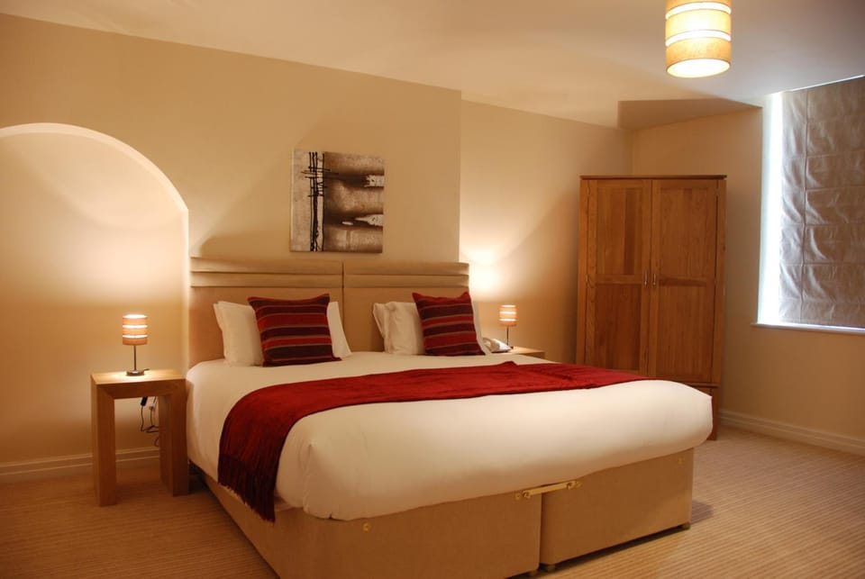 Premium bedding, desk, laptop workspace, soundproofing