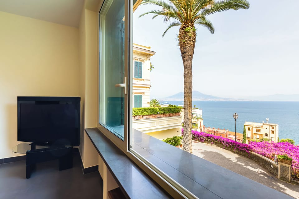 Apartment (1 Bedroom) | Living area | 32-inch Smart TV with cable channels