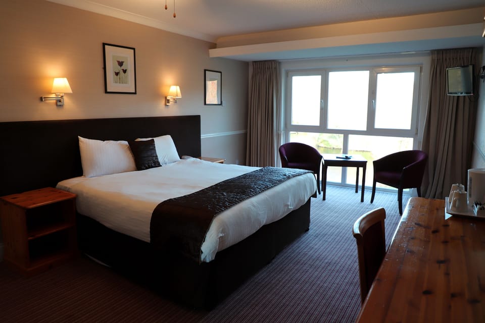 Double Room, Lake View | Desk, laptop workspace, iron/ironing board, free WiFi