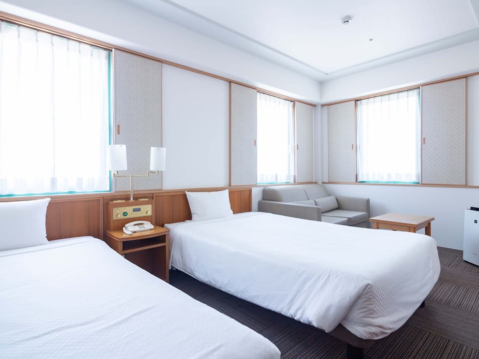 Twin Room, Non Smoking | Desk, laptop workspace, iron/ironing board (on request), WiFi (free)