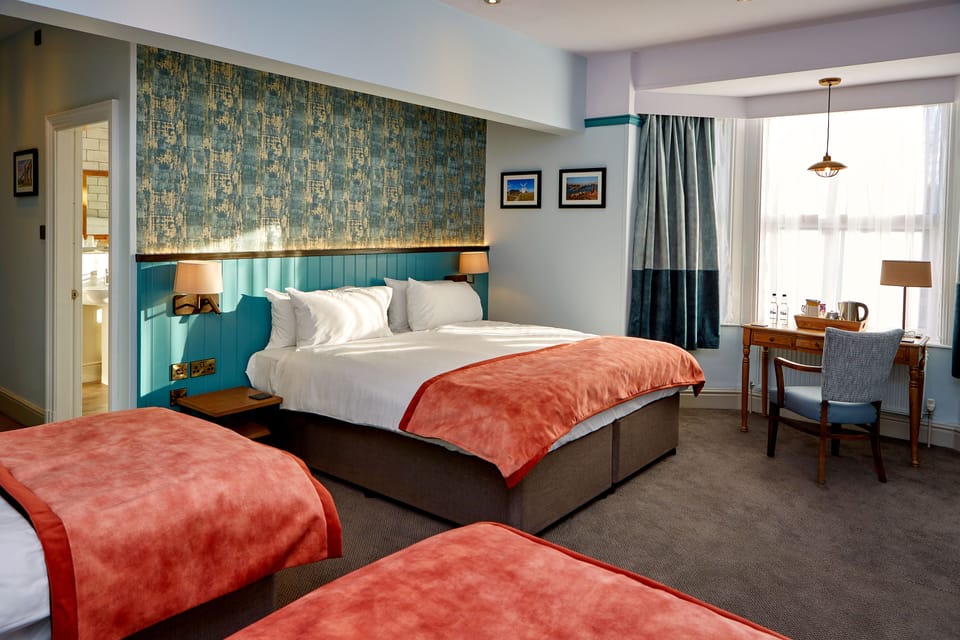 Family Room (Sleeps 4) | Desk, iron/ironing board, free WiFi, bed sheets