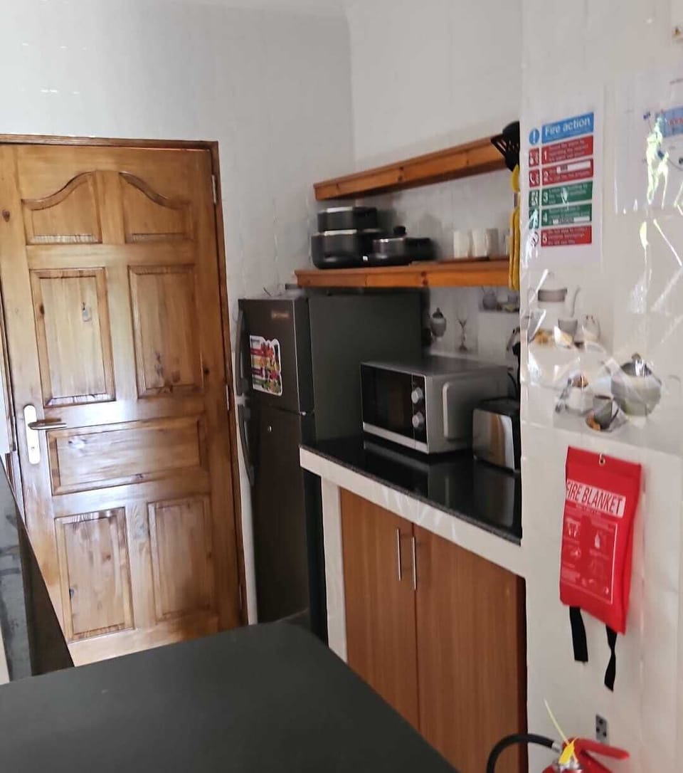 Fridge, microwave, stovetop, cookware/dishes/utensils
