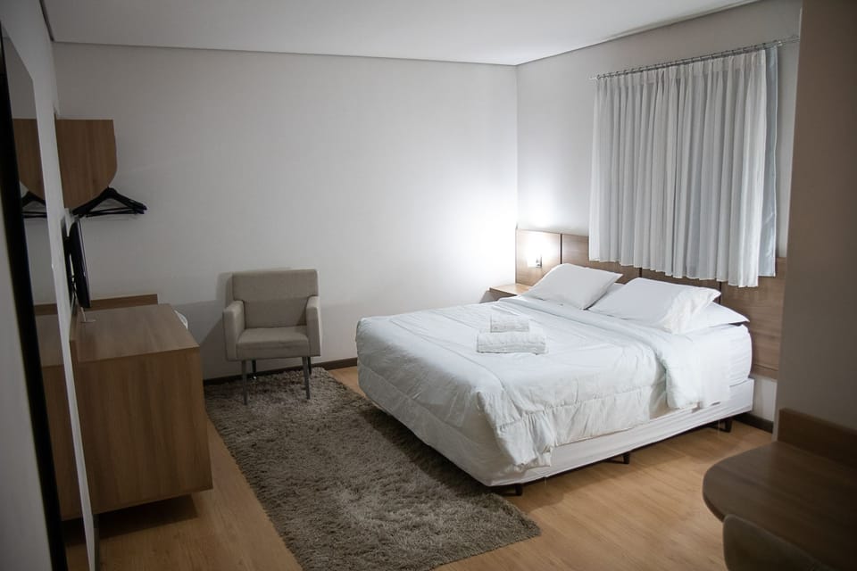 Double Room | Minibar, in-room safe, desk, blackout drapes