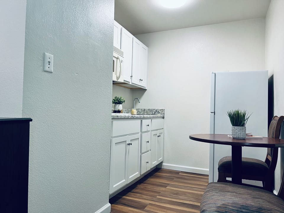 Mini-fridge, microwave, stovetop, cookware/dishes/utensils