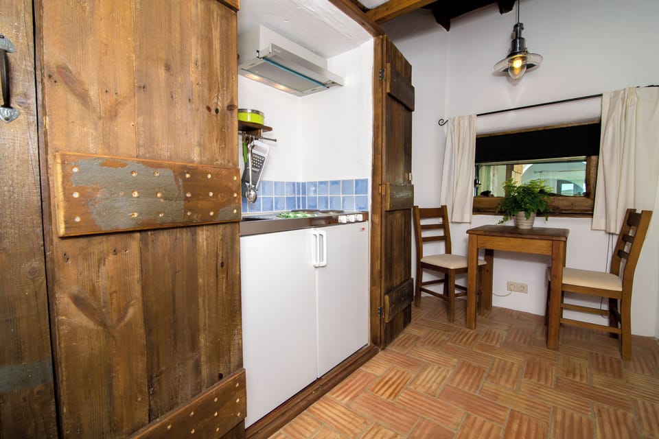 Superior Triple Room, Pool View | Private kitchenette