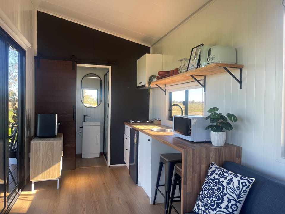 Studio, Balcony, Garden View | Living area | TV
