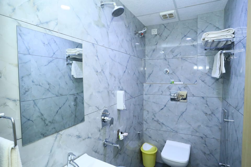 Shower, free toiletries, slippers, towels