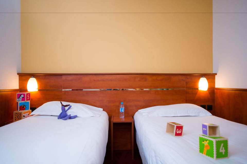 Twin Room | Premium bedding, desk, blackout drapes, soundproofing