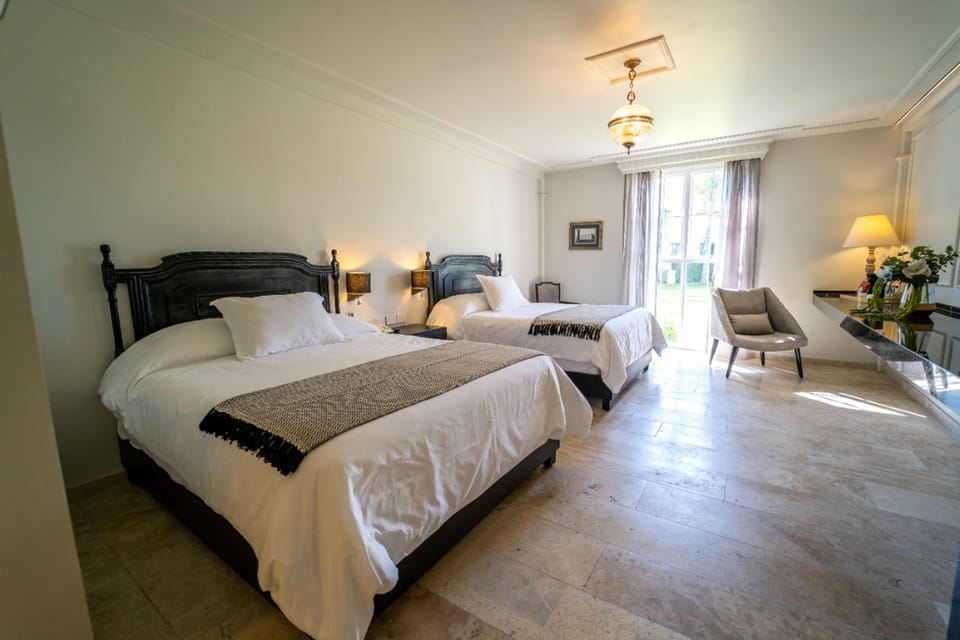 Contemporary Suite | 20 bedrooms, premium bedding, down comforters, in-room safe