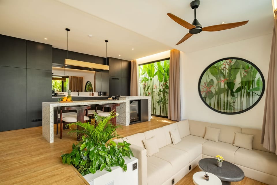 Deluxe Villa, 2 Bedrooms, Patio, Pool View | Living room | 65-inch TV with cable channels
