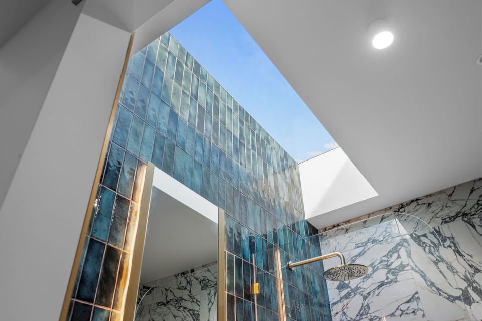 Exclusive Penthouse, City View | Bathroom | Shower, hair dryer, slippers, towels
