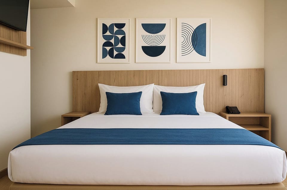 Deluxe Triple Room, River View | In-room safe, desk, laptop workspace, blackout drapes