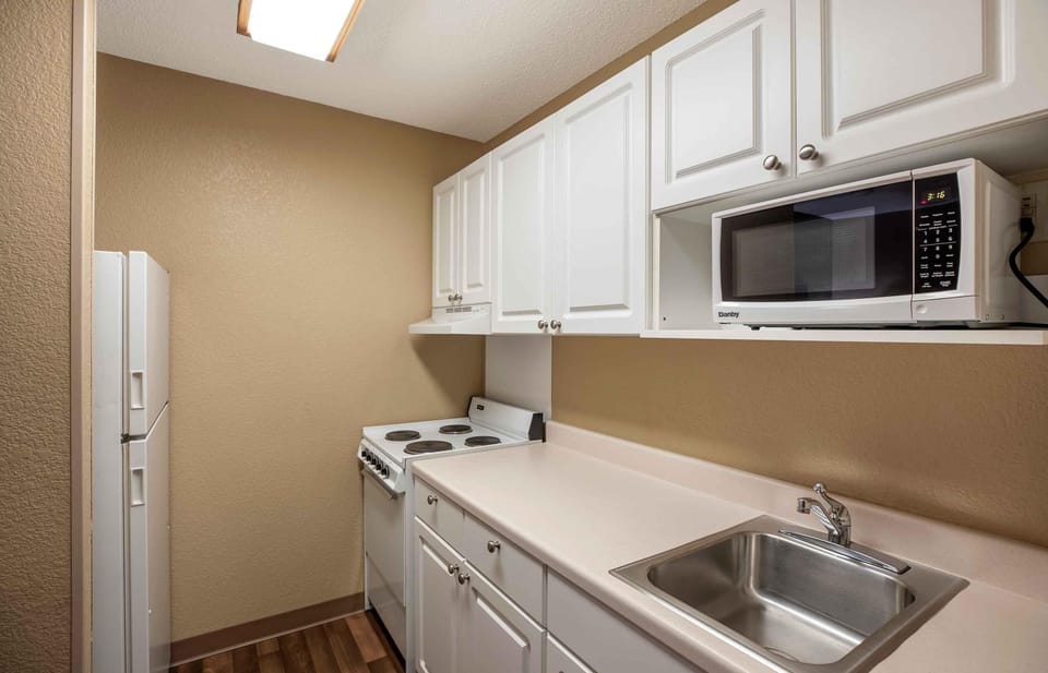 Studio, 1 Queen Bed, Non Smoking | Private kitchen | Full-size fridge, microwave, stovetop, coffee/tea maker