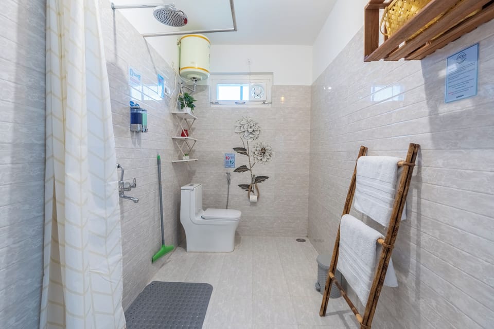 Shower, free toiletries, hair dryer, slippers