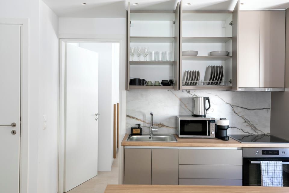 Apartment, 2 Bedrooms, Balcony, City View | Private kitchenette | Full-size fridge, microwave, oven, stovetop