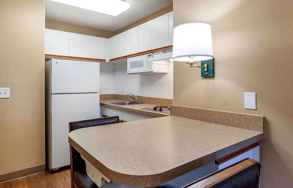 Deluxe Studio, 1 King Bed with Sofa bed, Non Smoking | Private kitchen | Full-size fridge, microwave, stovetop, coffee/tea maker