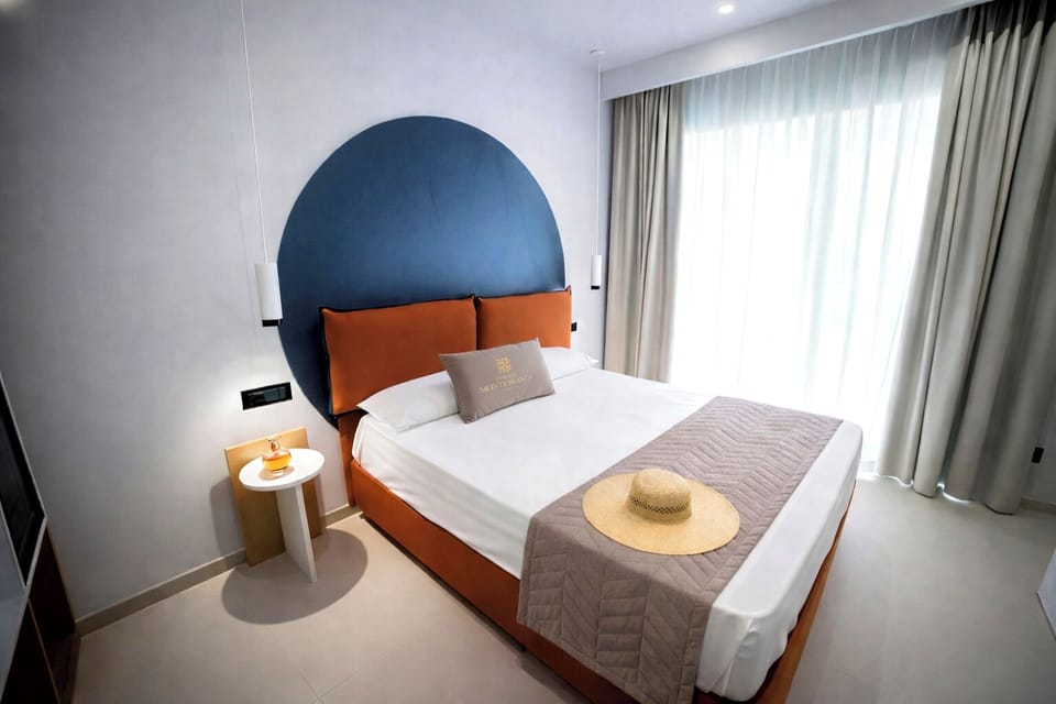 Deluxe Room, Patio | Minibar, in-room safe, individually decorated, individually furnished