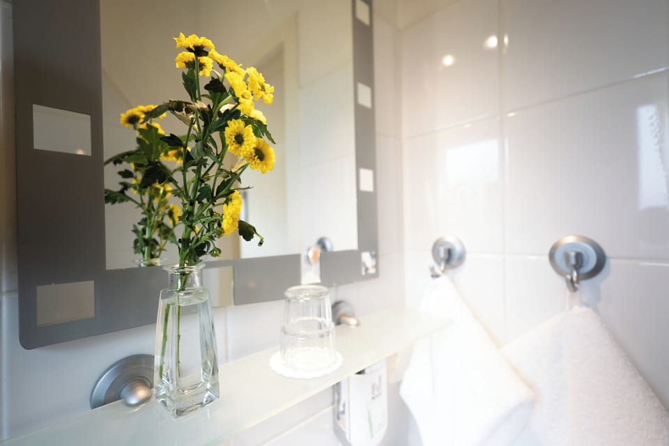 Standard Apartment (1) | Bathroom | Hair dryer, towels, soap, shampoo
