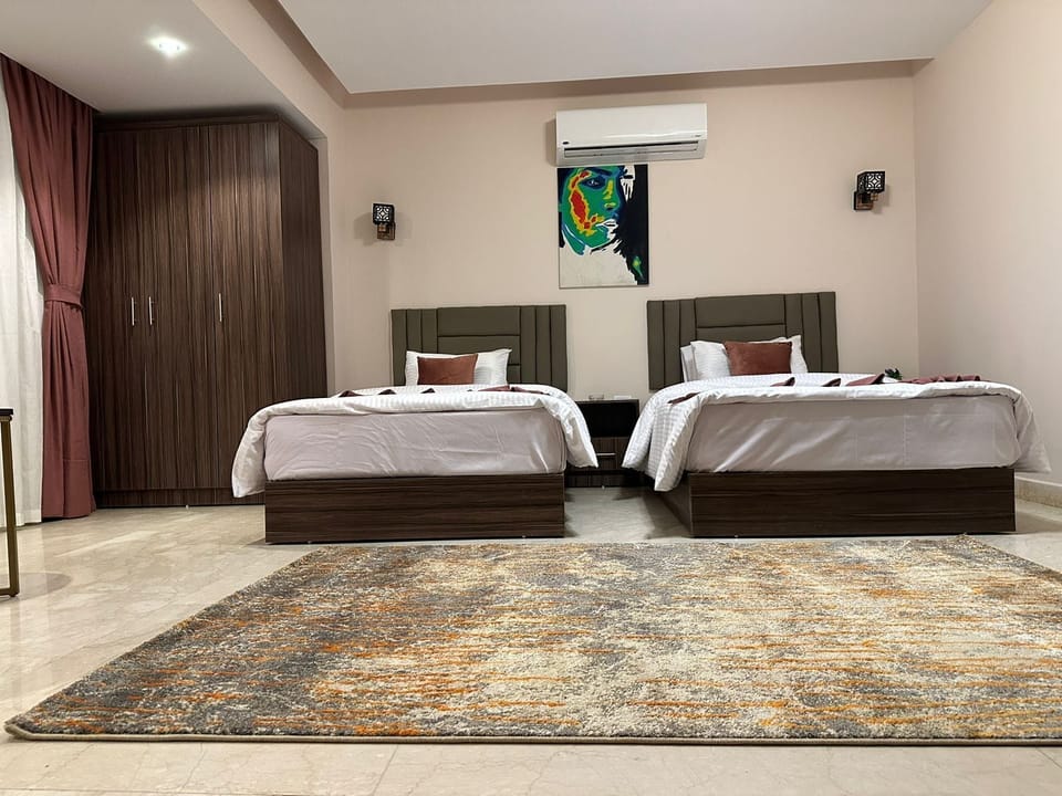 Deluxe Twin Room, City View | In-room safe, laptop workspace, soundproofing, iron/ironing board