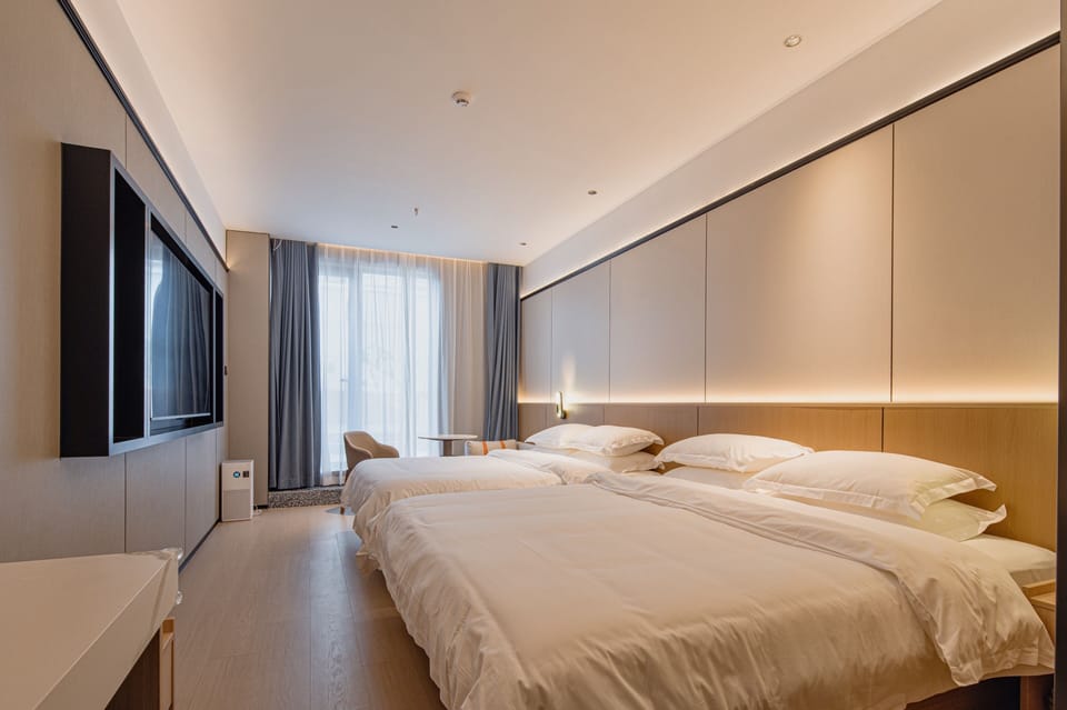 Family Twin Room with Courtyard View (1.2m & 1.8m Beds) | Blackout drapes, soundproofing, iron/ironing board, free WiFi