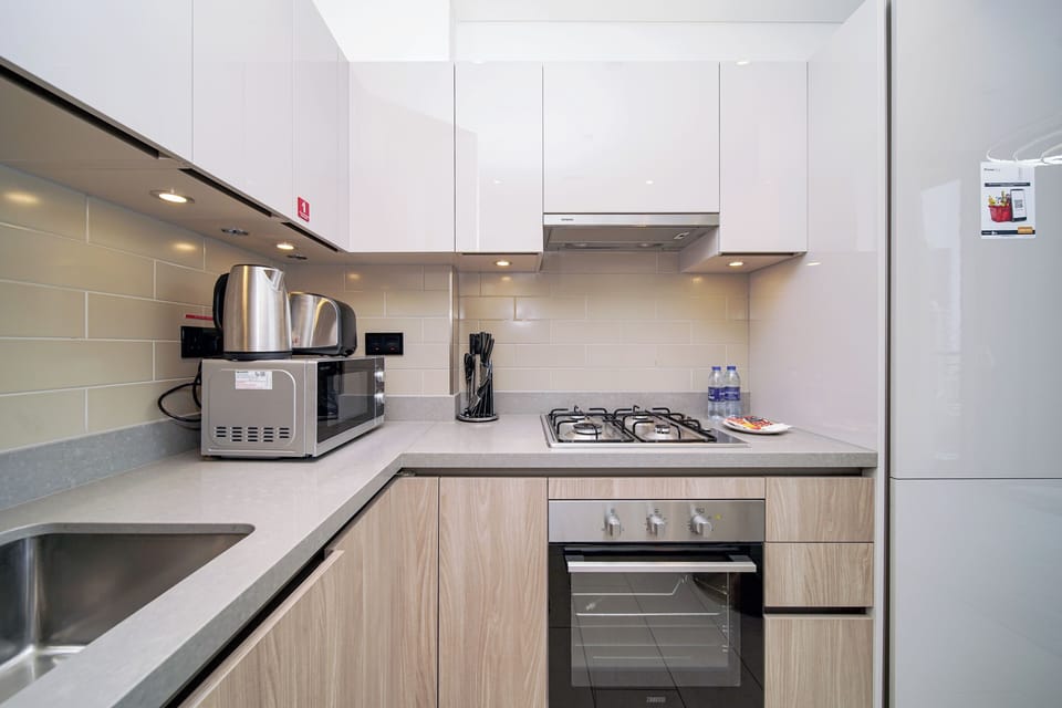 Luxury Apartment, Balcony, City View | Private kitchen | Full-size fridge, microwave, oven, stovetop