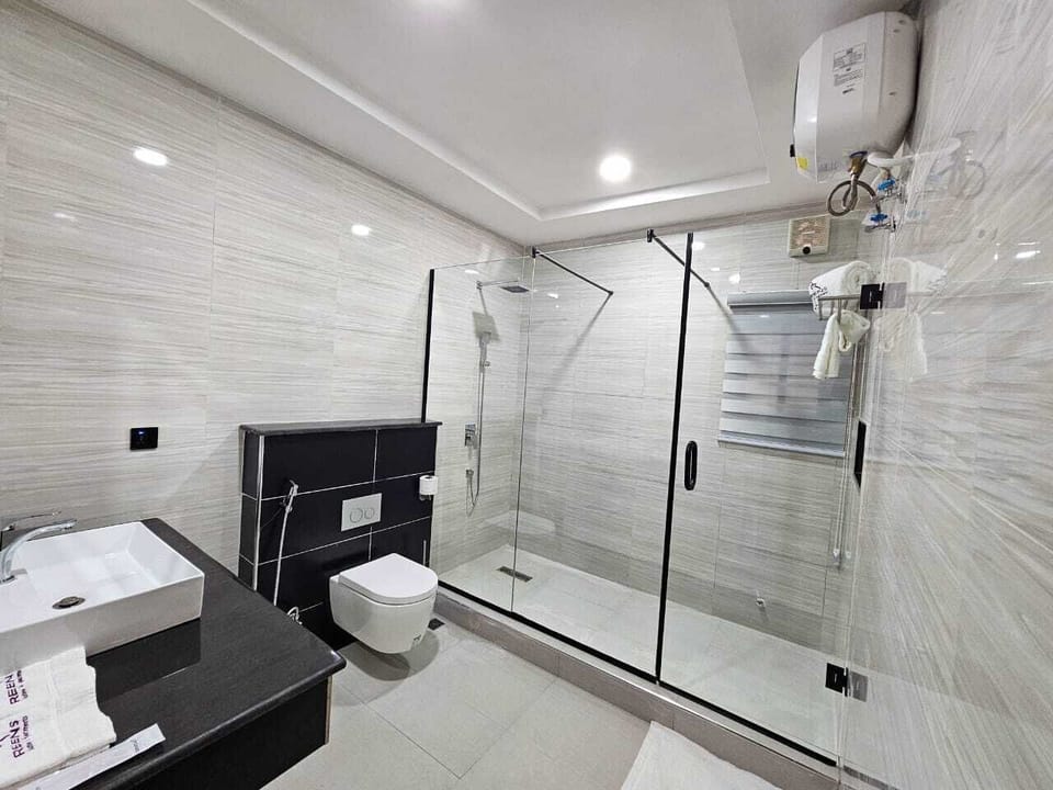 Shower, slippers, bidet, towels