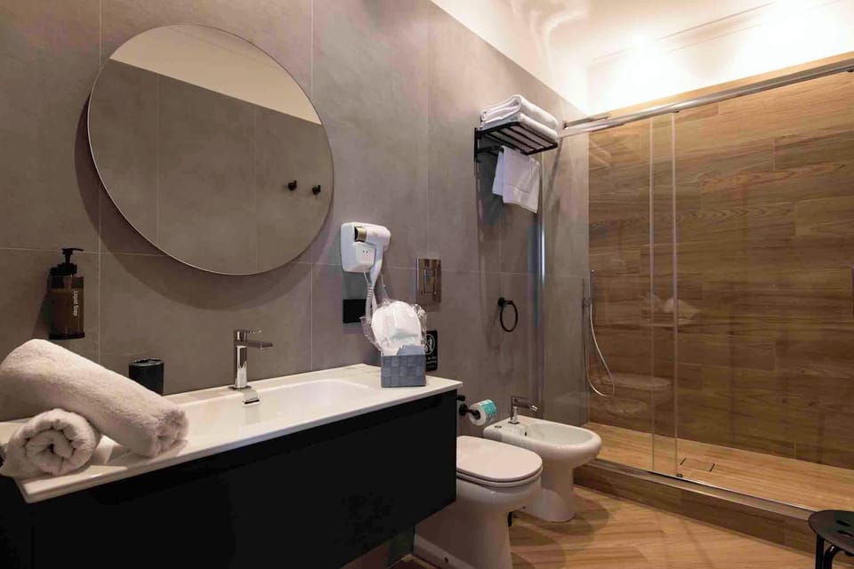 Family Double Room, City View | Bathroom | Hair dryer, slippers, bidet, towels