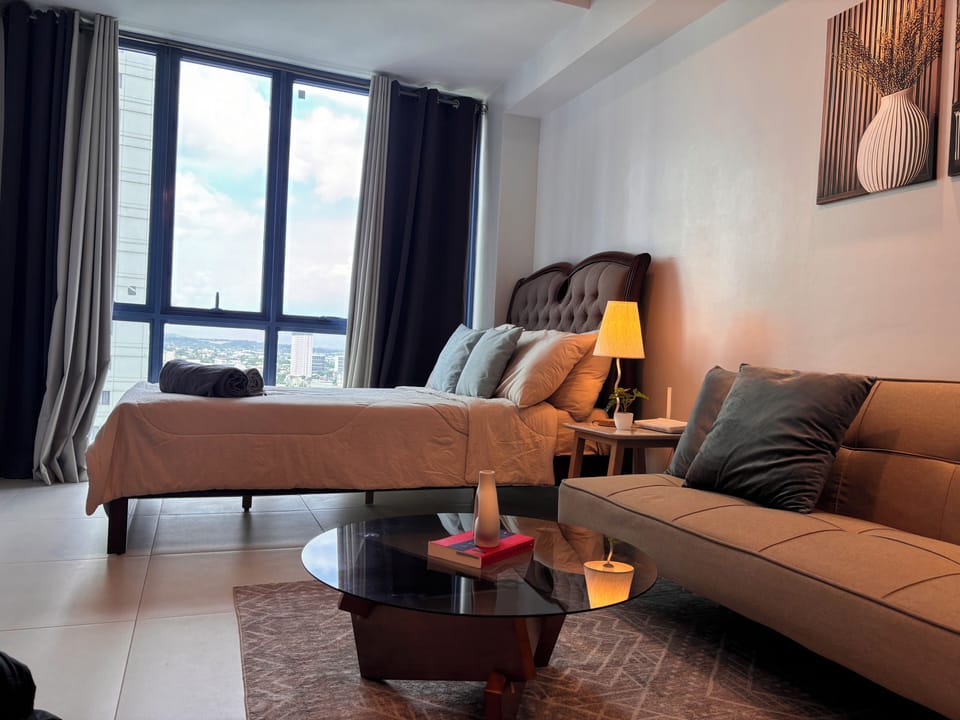 Deluxe Studio | Desk, laptop workspace, blackout drapes, iron/ironing board