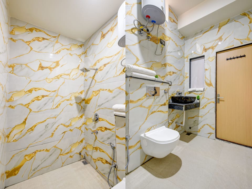 Superior Room | Bathroom | Shower, hair dryer, towels, soap