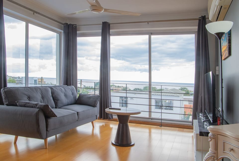 Junior Suite, Sea View | Living area | LED TV