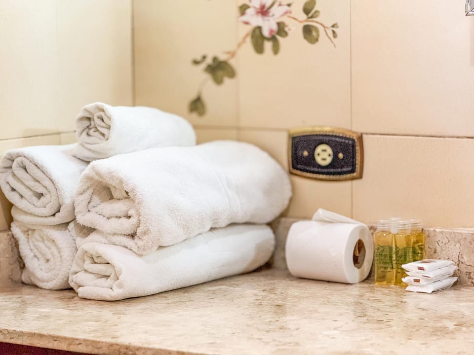 Superior Quadruple Room | Bathroom | Shower, free toiletries, hair dryer, towels