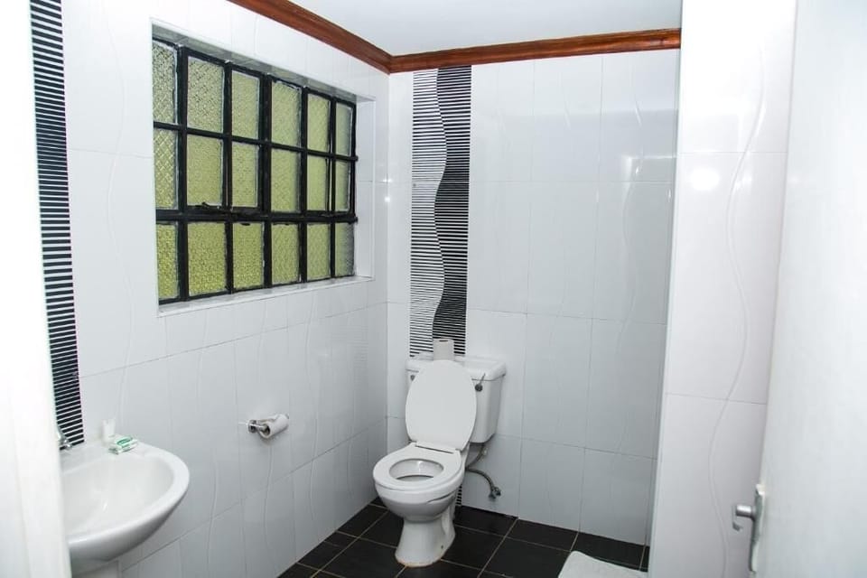Shower, rainfall showerhead, slippers, towels