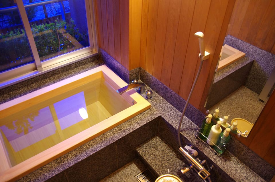 Japanese-Western Suite Room with Panoramic Onsen Bath | Bathroom | Separate tub and shower, spring water tub, free toiletries, hair dryer