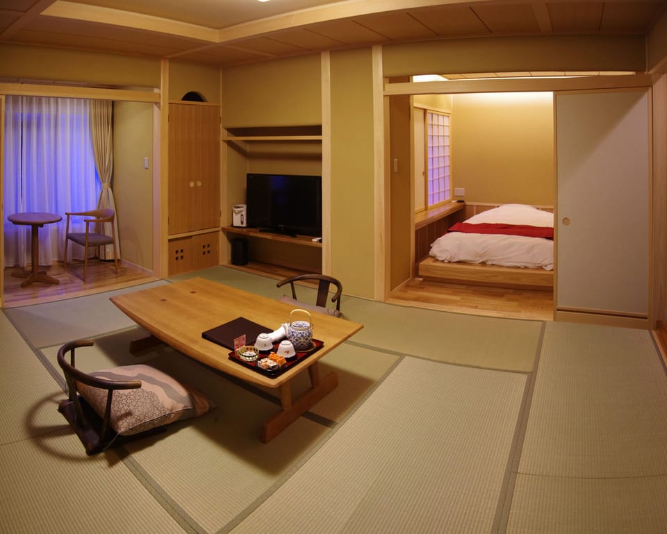 Japanese-Western Suite Room with Panoramic Onsen Bath | Premium bedding, in-room safe, desk, laptop workspace